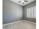 Bedroom with neutral walls, shutters, ceiling fan, and wood-style flooring at 10033 W Jj Ranch Rd, Peoria, AZ 85383