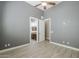 Bedroom featuring a ceiling fan and view of the ensuite bathroom at 10033 W Jj Ranch Rd, Peoria, AZ 85383