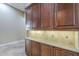 Custom cabinets with under cabinet lighting and granite countertops at 10033 W Jj Ranch Rd, Peoria, AZ 85383