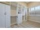 Spacious walk-in closet with custom shelves and drawers at 10033 W Jj Ranch Rd, Peoria, AZ 85383