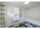 Walk-in closet featuring built-in shelving and storage cabinets for organization at 10033 W Jj Ranch Rd, Peoria, AZ 85383