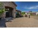 Stunning home exterior with stone accents, an arched entry, and a paver driveway at 10033 W Jj Ranch Rd, Peoria, AZ 85383