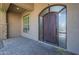 Elegant front door with arched window and sidelights at 10033 W Jj Ranch Rd, Peoria, AZ 85383