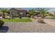 Manicured desert landscaping in the front yard provides curb appeal at 10033 W Jj Ranch Rd, Peoria, AZ 85383
