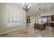Open-concept kitchen with large island and modern appliances connects seamlessly to living spaces at 10033 W Jj Ranch Rd, Peoria, AZ 85383