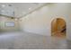 Spacious living room boasts high ceilings, recessed lighting, and arched doorways at 10033 W Jj Ranch Rd, Peoria, AZ 85383