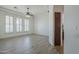 Bright and airy living room with tile flooring and plantation shutters at 10033 W Jj Ranch Rd, Peoria, AZ 85383