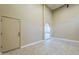 Bright living room with high ceilings, tile floor, neutral paint and an arched doorway to an adjacent room at 10033 W Jj Ranch Rd, Peoria, AZ 85383