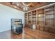 The office features custom shelving, wood paneled ceiling, and wood floors at 10033 W Jj Ranch Rd, Peoria, AZ 85383