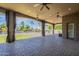 Spacious covered patio with ceiling fans overlooks the beautiful backyard pool area at 10033 W Jj Ranch Rd, Peoria, AZ 85383
