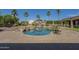 Sparkling pool and lush landscaping create a serene backyard retreat at 10033 W Jj Ranch Rd, Peoria, AZ 85383