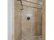 Walk-in shower with beige tiling and hand shower head at 10033 W Jj Ranch Rd, Peoria, AZ 85383