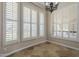 Corner shot of sun-soaked breakfast nook with plantation shutters on many windows at 10033 W Jj Ranch Rd, Peoria, AZ 85383