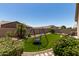 Backyard with desert landscaping, turf, and a custom playset at 11755 W Patrick Ln, Sun City, AZ 85373