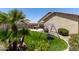 A backyard featuring desert landscaping, turf and a custom playset at 11755 W Patrick Ln, Sun City, AZ 85373