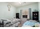 Bright bedroom featuring two twin beds, soft color palette, and large window with natural light at 11755 W Patrick Ln, Sun City, AZ 85373