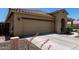 This beautiful home boasts a spacious two-car garage and an inviting exterior with well-maintained landscaping at 11755 W Patrick Ln, Sun City, AZ 85373