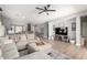 Open-concept living room with contemporary furnishings and a neutral color palette, ideal for relaxing or entertaining at 11755 W Patrick Ln, Sun City, AZ 85373