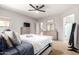 Bright main bedroom with generous natural light and view into ensuite bath at 11755 W Patrick Ln, Sun City, AZ 85373