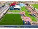 Community aerial shot of clubhouse, splashpad, picnic pavillions and event lawn at 12039 E Primrose Ln, Florence, AZ 85132