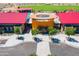 Aerial view of community clubhouse with pool, splash pad and seating areas at 12039 E Primrose Ln, Florence, AZ 85132