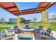 Outdoor seating area with modern patio furniture and a fire pit, perfect for gatherings at 12039 E Primrose Ln, Florence, AZ 85132