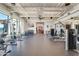 Spacious gym area with weightlifting equipment, large windows, and modern ceiling design at 12039 E Primrose Ln, Florence, AZ 85132