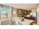 Bright kitchen features stainless steel appliances, breakfast bar, and a window with a view at 12039 E Primrose Ln, Florence, AZ 85132