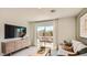 Cozy living room with sliding glass doors leading to an outdoor patio at 12039 E Primrose Ln, Florence, AZ 85132