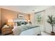 Inviting main bedroom with warm lighting, a queen bed and a serene atmosphere at 12039 E Primrose Ln, Florence, AZ 85132