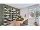 Stylish home office featuring a modern desk and shelving, perfect for a productive workspace at 12039 E Primrose Ln, Florence, AZ 85132