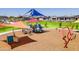Community playground features swings, slides, and play structures, offering outdoor fun at 12039 E Primrose Ln, Florence, AZ 85132
