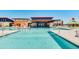 Beautiful pool area featuring a volleyball net and ample space for swimming and activities at 12039 E Primrose Ln, Florence, AZ 85132