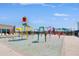 Vibrant splash pad area with colorful water features, ideal for Gathering fun and entertainment at 12039 E Primrose Ln, Florence, AZ 85132