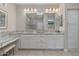 Large bathroom featuring double sink vanity, granite countertops, framed mirrors, and a modern walk-in shower at 13186 W Via Dona Rd, Peoria, AZ 85383