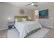 A serene bedroom featuring neutral tones, accent pillows, and natural light, creating a peaceful retreat at 13186 W Via Dona Rd, Peoria, AZ 85383