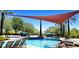 Large community pool with shade and plenty of seating providing a fantastic place to unwind and have fun at 13186 W Via Dona Rd, Peoria, AZ 85383