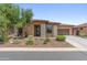 Well-maintained home showcasing a blend of stone and stucco exterior with a beautifully landscaped front yard at 13186 W Via Dona Rd, Peoria, AZ 85383