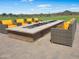 Inviting outdoor fire pit area with comfortable seating, ideal for social gatherings and relaxation at 13186 W Via Dona Rd, Peoria, AZ 85383