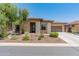 Beautiful single-story home with desert landscaping and a light tan exterior at 13186 W Via Dona Rd, Peoria, AZ 85383