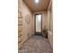 Private front porch features a textured brick floor, modern lighting, and space for potted plants at 13186 W Via Dona Rd, Peoria, AZ 85383