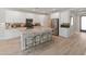 Bright, modern kitchen with a large island and stainless steel appliances at 13186 W Via Dona Rd, Peoria, AZ 85383