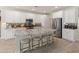 Bright kitchen with a large island, granite countertops, and stainless steel appliances at 13186 W Via Dona Rd, Peoria, AZ 85383