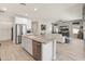 Bright, open kitchen featuring stainless steel appliances, granite countertops, and large island at 13186 W Via Dona Rd, Peoria, AZ 85383