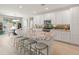 Spacious kitchen with island, granite countertops, stainless appliances, and adjacent breakfast nook at 13186 W Via Dona Rd, Peoria, AZ 85383