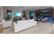 Bright and airy living room that opens to the outdoor living area with a fire pit and pool at 13186 W Via Dona Rd, Peoria, AZ 85383