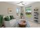Bright living room with views of the garden and pool and with elegant decor and lots of natural light at 13186 W Via Dona Rd, Peoria, AZ 85383