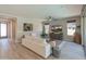 Cozy living room with wood floors, lots of light and stylish, neutral furnishings at 13186 W Via Dona Rd, Peoria, AZ 85383