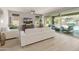 Cozy living room with views of the backyard and pool at 13186 W Via Dona Rd, Peoria, AZ 85383