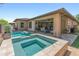 Beautiful backyard pool and spa with travertine tile, offering a serene oasis for relaxation and recreation at 13186 W Via Dona Rd, Peoria, AZ 85383
